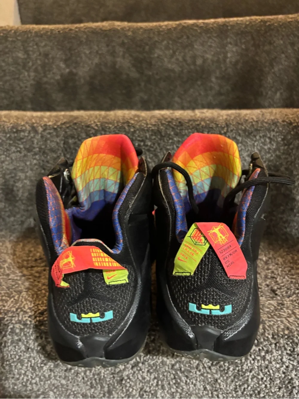 The Nike LeBron 12 Data Size 13 in black/orange colorway features icy bottoms,